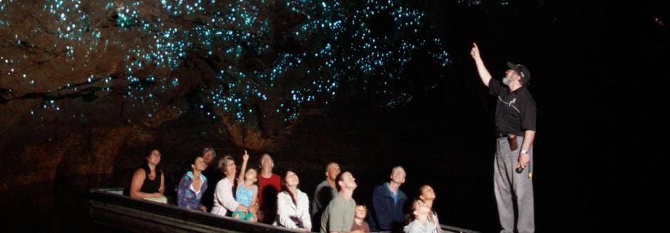 Group of people exploring the glowworm caves in waitomo